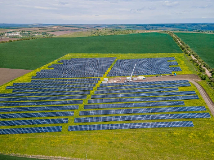 Extensive solar power plant in a vibrant green rural landscape